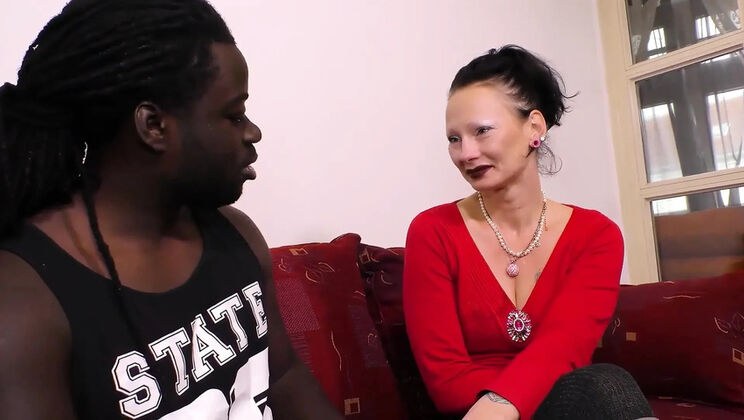 Tattooed MILF Rides Muscular Black Guy on Couch in Hot Interracial Video